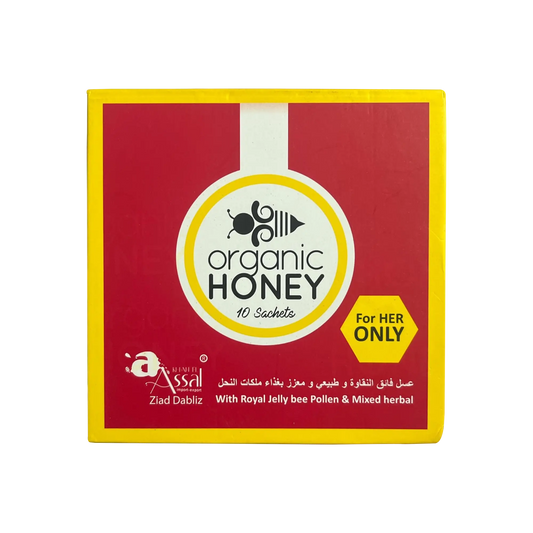 A square red and yellow box of organic honey sachets by Ziad Dabitz, featuring a white circular logo with a bee illustration and the text 'organic HONEY' on a white background.